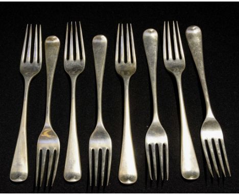 A set of eight George III sterling silver Hanoverian pattern entree forks, each engraved with a period crest of a lion rampan