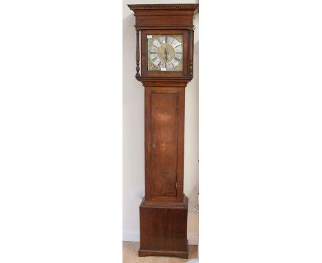 A George III oak 30 hour longcase clock, the 10 inch dial inscribed 'Phillips, Ashbourn' the hood with an overhanging cornice