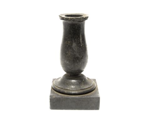 A Solomon Island native stone carved and polished vessel of candlestick form