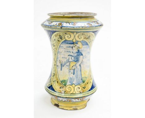 An Italian maiolica pharmacy jar or albarello, probably 16th century, waisted form, decorated with a central image of St Fran