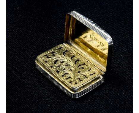 A George IV sterling silver vinaigrette, with engine turned decoration and scroll thumb-piece, marked for William Simpson, Bi