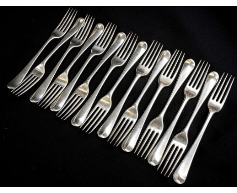 A superior set of fifteen early George III sterling silver Hanoverian pattern silver dinner forks, all with matching period e