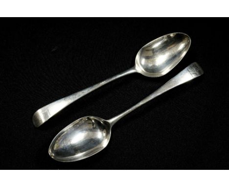 A pair of George III sterling silver old English pattern tablespoons, each with an engraved crest of a dragon to each finial,