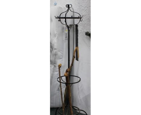 Black metal coat/stick stand and four handmade walking sticks