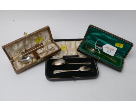 Three cased silver spoons, one with fork