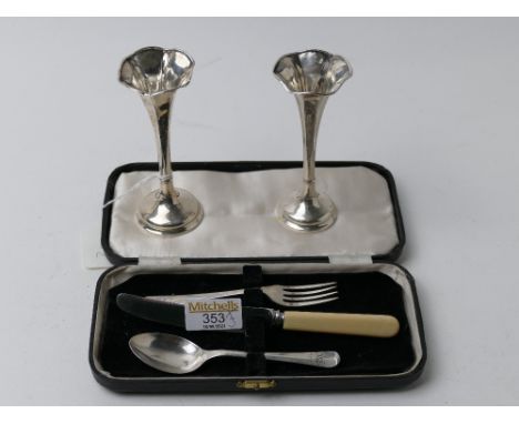 Cased silver fork and spoon and two bud vases