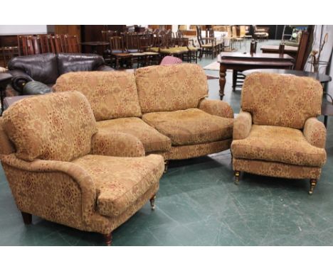 Three piece suite to include two seater sofa and two armchairs 