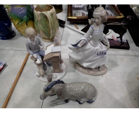 Lladro figure (A/F) together with a Nao figure of a donkey and a Leonardo figure of a boy and puppy. Not available for in-hou