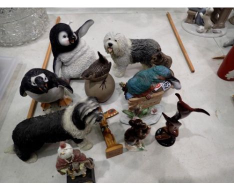 Collection of resin and ceramic figures, including penguins and dogs etc. Not available for in-house P&amp;P 
