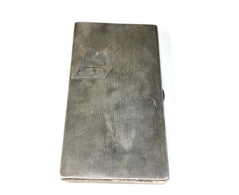 Large heavy engine turned cigarette case dog motif measures approx 15cm by 8cm weight 250g 