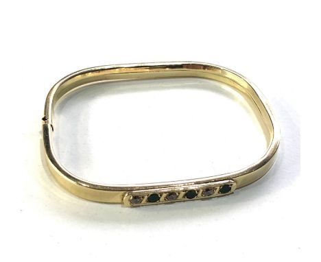 14ct gold gemstone set  bangle measures approx 6.5cm by 5.5cm weight 10g 