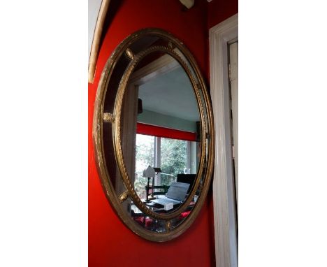 *Item to be collected from Friargate, Derby*A Neo Classical style gilt gesso oval wall mirror, approx 82cm high x 62.5cm wide