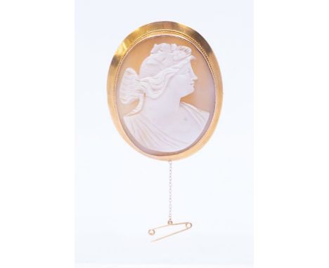 *Item to be collected from Friargate, Derby* A Victorian 9ct gold and shell cameo oval brooch, carved depicting a bacchante, 
