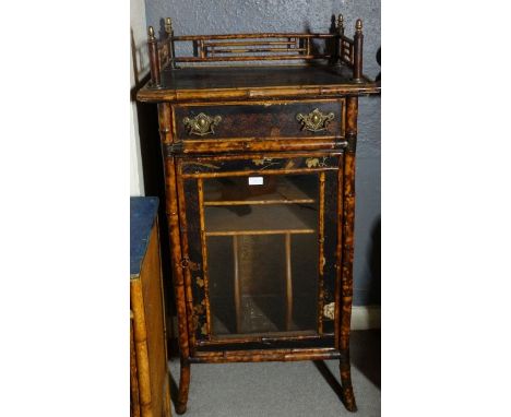 *Item to be collected from Friargate, Derby*An early 20th century Chinoiserie bamboo cabinet, the galleried top above a singl