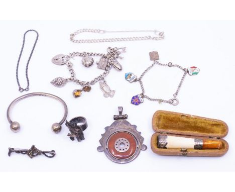 *Item to be collected from Friargate, Derby* A silver charm bracelet with white metal charms; together with another bracelet 