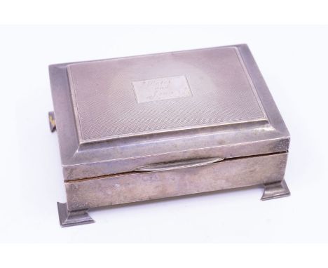 *Item to be collected from Friargate, Derby* A QEII silver rectangular cigarette box, the slightly raised cover with engine t