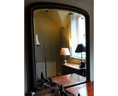 *Item to be collected from Friargate, Derby*A Victorian arched rectangular over-mantle mirror, bevelled glass, carved detail 