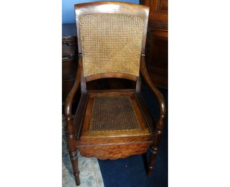 *Item to be collected from Friargate, Derby*A 19th Century mahogany bergere commode armchair, down swept arms, turned legs, s