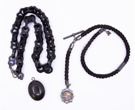 *Item to be collected from Friargate, Derby* A Victorian hairwork watch chain, with white metal mounts and T-bar, with a comp