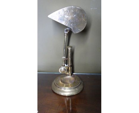*Item to be collected from Friargate, Derby* An early 20th century brass library reading lamp, telescopic stand, swivel light