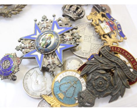 Assorted enamel badges and a few coins 