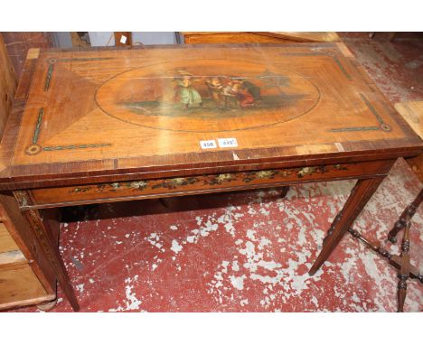 A Victorian satinwood and painted folding card table, circa 1870, with baise lined playing surface, 74cm high, 91cm wide, 46c