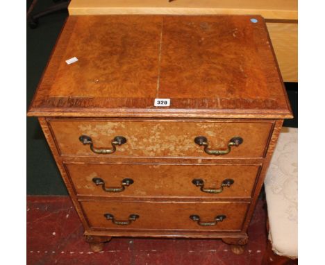 A small reproduction chest of drawers and a Victorian mahogany square stool, a walnut glazed bookcase