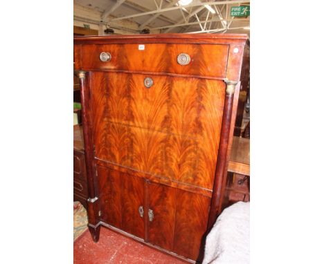 A French mahogany secretaire a abbatant, circa 1810, with a frieze drawer, the fall enclosing pigeon holes and drawers flanke