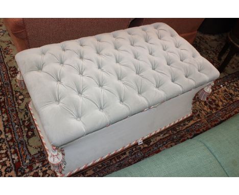 A button upholstered stool of sarcophagus form, 98cm