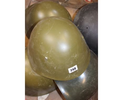 Four Soviet SSH-68 stool helmets of standard production specification complete with liners 