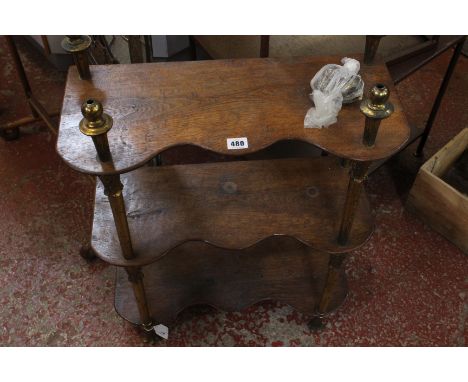 A set of 19th Century hanging oak shelves with metalware supports 75cm high, 55cm wide, together with a stained glass firescr