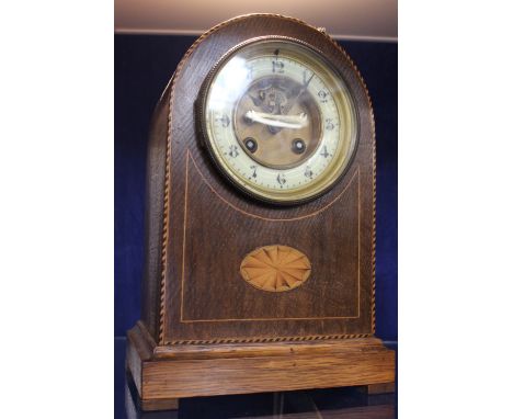 An Edwardian mahogany inlaid mantel clock
