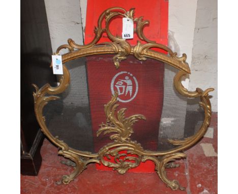 A Louis XV style gilt metal and mesh firescreen of cartouche outline, 83cm high, 70cm wide 