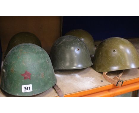 Four Soviet SSH-68 stool helmets of standard production specification complete with liners 