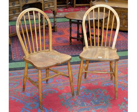 A pair of Ercol kitchen chairs, original paper labels