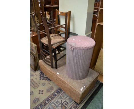 A Lloyd loom linen basket; two ladder back chairs; a pine blanket box (4)