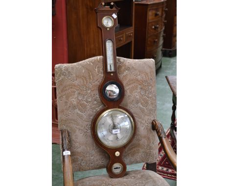 A George III mahogany banjo barometer, silvered circular register, the lower register inscribed Manchester Warranted, broken 