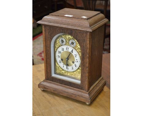 A large oak cased Junghans Biz mantel clock, three winding holes, chime/silent and slow/fast subsidiary dials