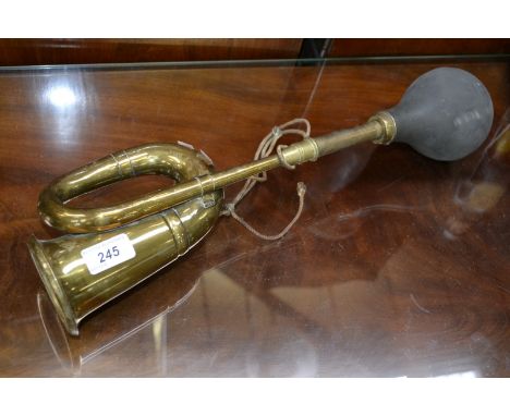 A vintage brass car horn