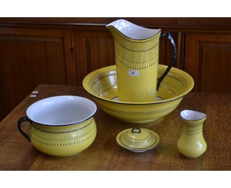 A Soho potteries five piece  Art Deco wash set, yellow ground with black symmetrical pattern,comprising wash bowl, pitcher,ch