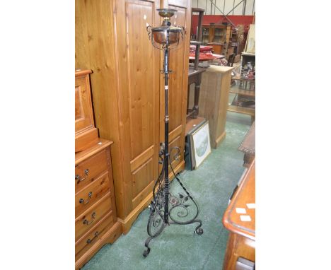A Vintage decorative wrought iron and brass telescopic oil standard lamp converted to electric.