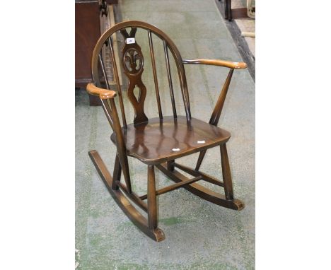 An Ercol child's rocking chair 