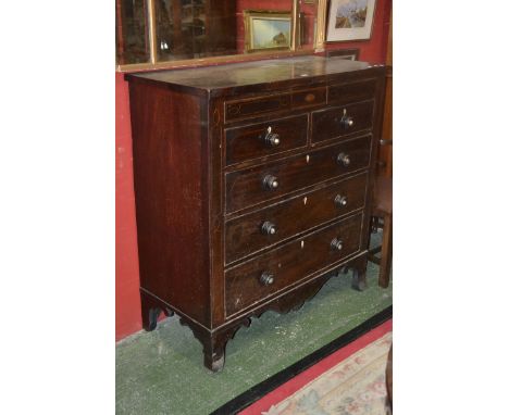 A Victorian mahogany chest, inlaid throughout, turned handles, two short over three long drawers, bracket feet