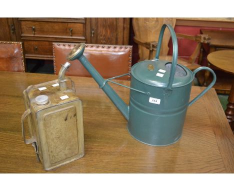 A vintage green watering can; 50 paraffin can