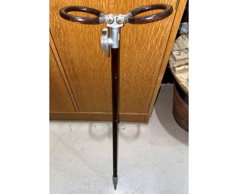 A shooting stick by John Collier for Gamages 