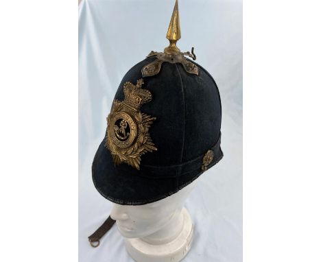 A Durham Light Infantry style helmet with brass coloured mounts 