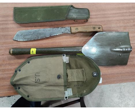 An AmericanArmy trench digging shvel with canvas cover and a British army machete 