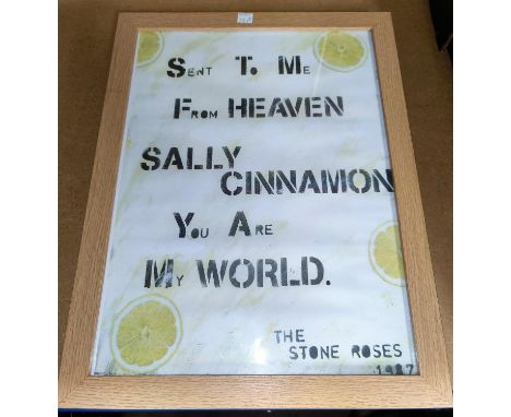 A framed Stone Roses print 