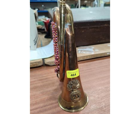 A copper and brass bugle with Royal Welsh Fusliiers badge 