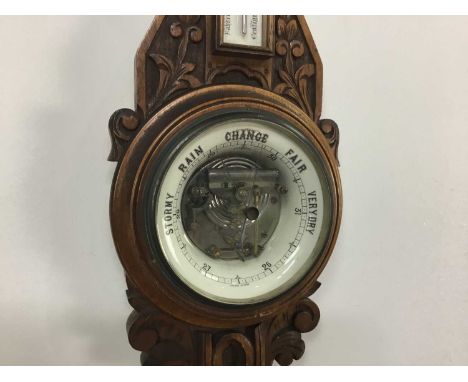 VICTORIAN ANEROID BAROMETER In carved oak case82cm high